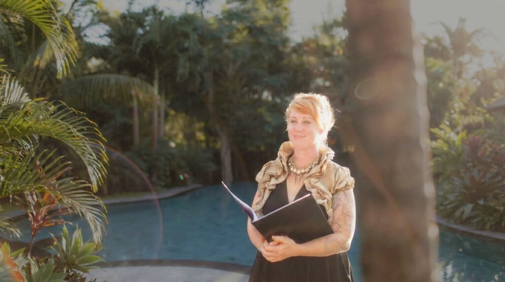 Talitha Mitchell Talitha, Australian psychic, medium, tarot - standing near a pool