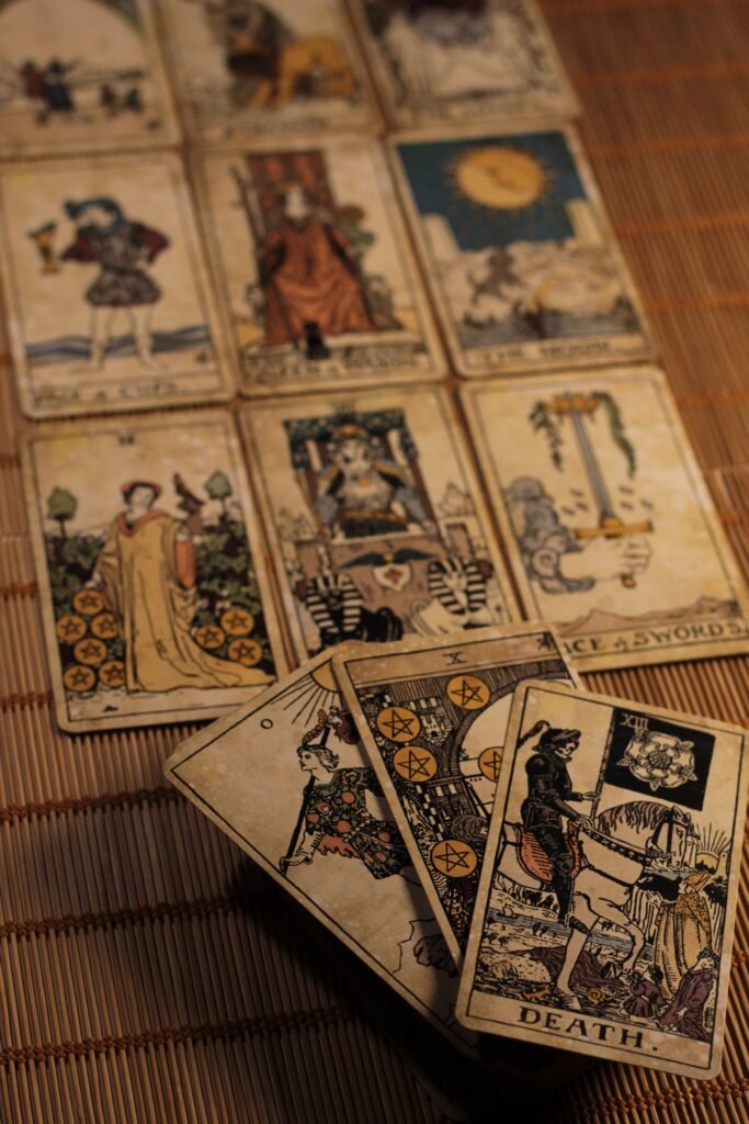 pexels-photo-32820642-32820642 A captivating spread of vintage tarot cards laid out on a bamboo mat, creating a mystical ambiance.